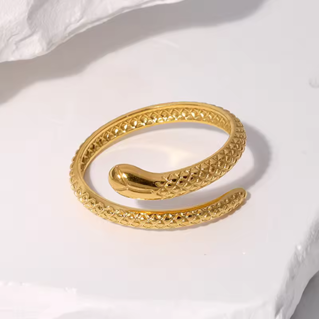 Gold plated snake ring,
Snake-shaped open ring,
Stainless steel snake ring,
Gold snake ring,
Open ring with snake design,
Gold plated stainless steel ring,
Snake motif ring,
Adjustable snake ring,
Gold snake-shaped ring,
Contemporary snake ring,
Gold snake ring for men,
Unique snake-shaped ring,
Modern gold snake ring,
Serpent design open ring,
Fashionable snake ring