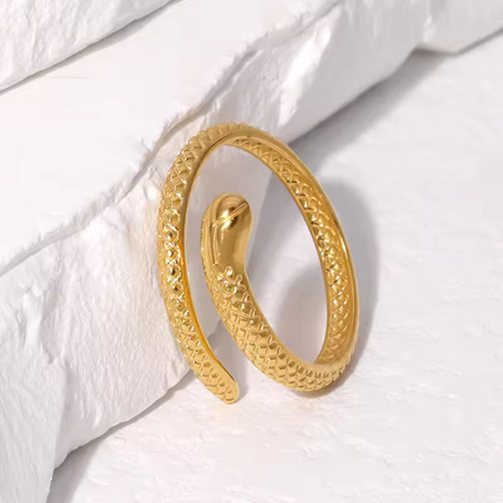 Gold plated snake ring,
Snake-shaped open ring,
Stainless steel snake ring,
Gold snake ring,
Open ring with snake design,
Gold plated stainless steel ring,
Snake motif ring,
Adjustable snake ring,
Gold snake-shaped ring,
Contemporary snake ring,
Gold snake ring for men,
Unique snake-shaped ring,
Modern gold snake ring,
Serpent design open ring,
Fashionable snake ring