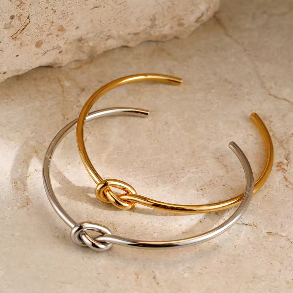 Gold plated cuff bracelet,
Knot design bangle,
Gold bangle bracelet,
Gold plated knot bracelet,
Elegant knot cuff,
Gold cuff bracelet with knot,
Gold plated bangle bracelet,
Knot detail bangle,
Sophisticated cuff bracelet,
Stylish gold knot bracelet,
Adjustable gold cuff bracelet,
Gold knot bangle,
Modern gold cuff bracelet,
Classic knot cuff bracelet,
Trendy gold plated bangle