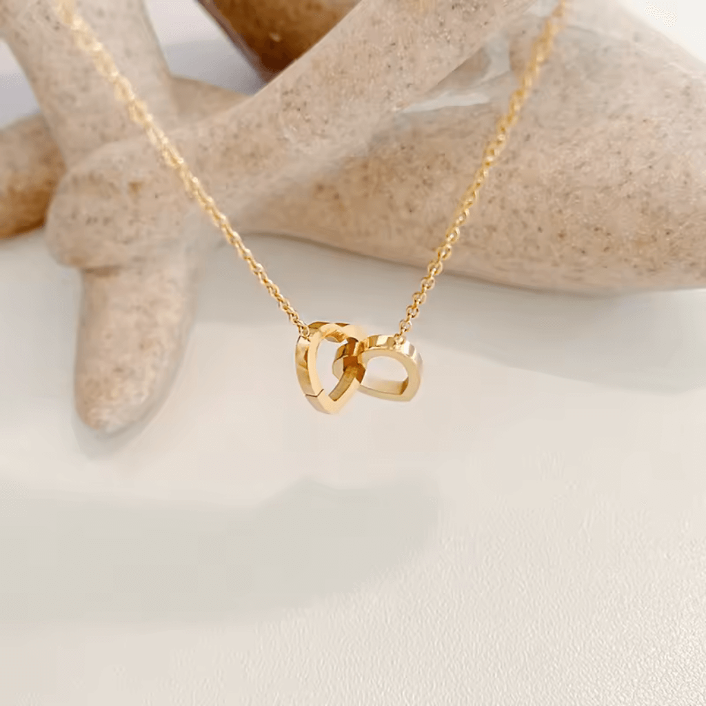 Double heart necklace,
Gold plated heart necklace,
Heart-shaped gold necklace,
Romantic gold heart necklace,
Gold double heart pendant,
Heart necklace with gold plating,
Gold heart jewelry,
Double heart gold necklace,
Gold plated love necklace,
Elegant heart necklace,
Gold heart charm necklace,
Gold double heart necklace,
Personalized heart necklace,
Gold plated couple's necklace,
Gold plated necklace with heart charms