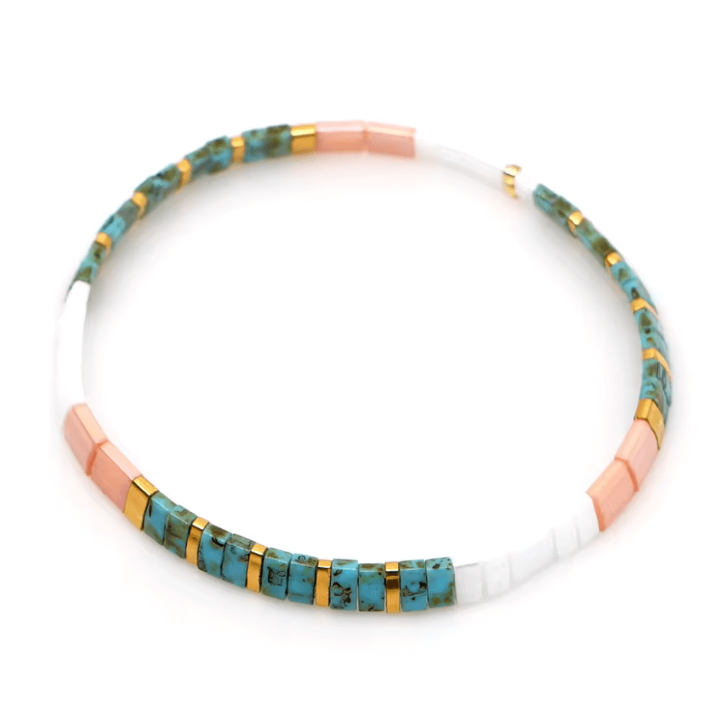 Go2Boho Bohemian colorful elastic summer beach bracelet with blue, pink, and white beads and gold accents for beachside style